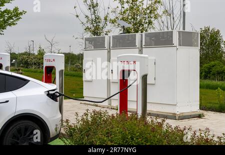 Midlands, UK - 13 May 2023: Tesla electric car charging points on motorway Stock Photo