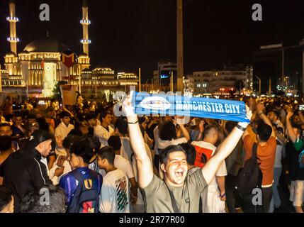 English football fans celebrating Manchester City victory over Inter in UEFA Champions League final in Istanbul Turkey. Taksim square Stock Photo