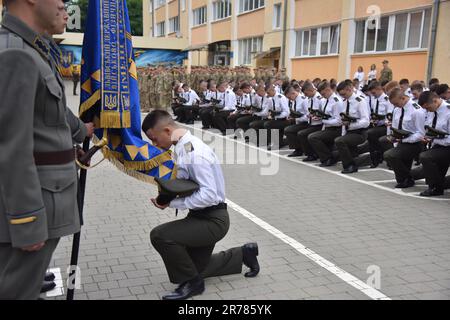 A cadet kisses the lyceum flag during the graduation ceremony at the ...