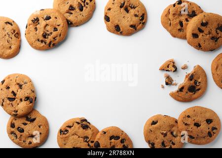 Frame made of many delicious chocolate chip cookies on white background, flat lay. Space for text Stock Photo