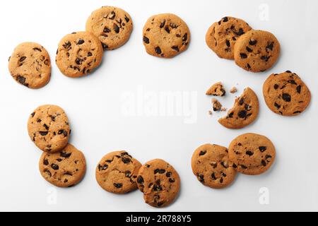 Frame made of many delicious chocolate chip cookies on white background, flat lay. Space for text Stock Photo