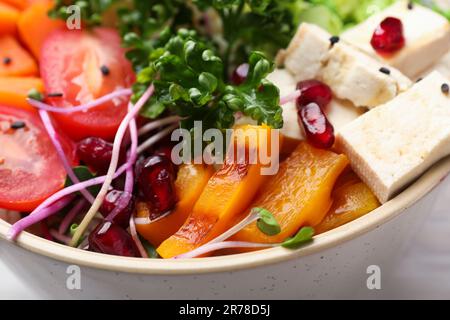 Bowl with many different vegetables on table, closeup. Vegan diet Stock Photo