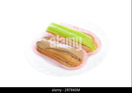 close up shot of two eclairs, isolated on white Stock Photo