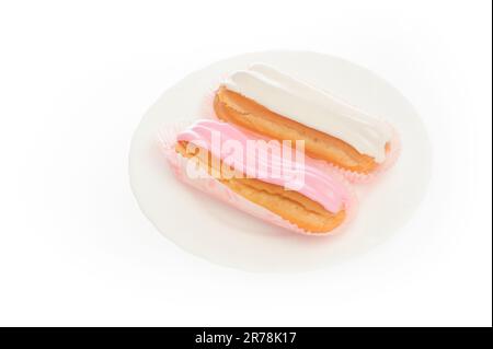 close up shot of two eclairs, isolated on white Stock Photo