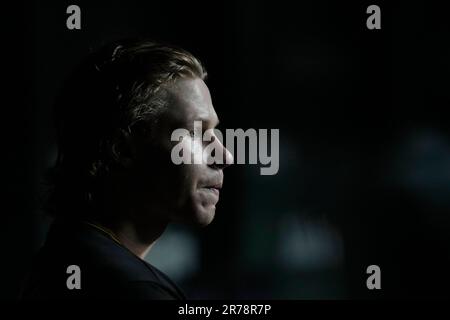 Pittsburgh Pirates center fielder Jack Suwinski looks out of the dugout  before the start of a baseball game against the Miami Marlins, Friday, June  23, 2023, in Miami. (AP Photo/Wilfredo Lee Stock