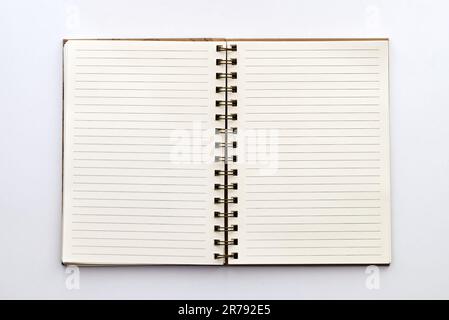 Open paper notebook with lined pages isolated on white background Stock Photo