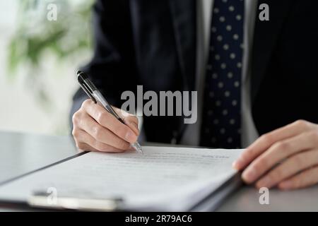 Asian businessman checking the content of documents Stock Photo