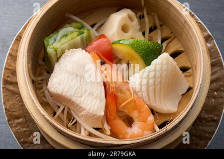 Japanese cuisine, steamed chicken and shrimp, squid and vegetables Stock Photo