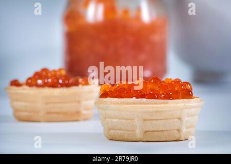 Tartlets with red caviar. Cold appetizers. Seafood Stock Photo