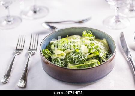 helathy green spinach and kohlrabi salad served as main dish in the restaurant. Stock Photo