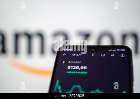 Stock market graph of Amazon company on smartphone screen. Amazon.com, Inc. is an American multinational technology company. Stock Photo