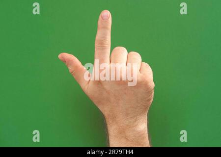 Gestures pack. Male hand touching, clicking, tapping and swiping on chromakey green screen. Zoom in, zoom out. Close up. Using for a smartphone, table Stock Photo