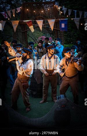 Old Time Sailors performing at Trebah Garden Amphitheatre in Cornwall in the UK. Stock Photo