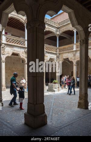 House of Shells patio, view in summer of people visiting the renaissance-era patio courtyard inside the Casa de las Conchas in Salamanca, Spain Stock Photo