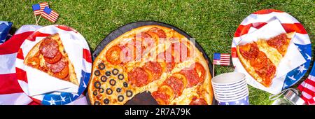 july 4th holiday party pizza, Fourth of July, Patriotic Independence day festive and picnic food. Pepperoni, tomato and black olive pizza with lot of Stock Photo