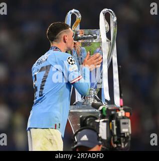 Istanbul, Turkey. 10th June, 2023. 10 Jun 2023 - Manchester City v Inter Milan - UEFA Champions League - Final - Ataturk Olympic Stadium.                                                                                Manchester City's Phil Foden kisses the Champions League trophy. Picture Credit: Mark Pain / Alamy Live News Stock Photo