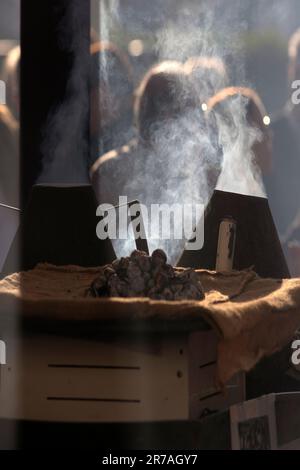 Europe, Portugal, Alentejo Region, Golega, Chestnuts being Roasted on a Charcoal Stove in the Market at the Horse Fair Stock Photo