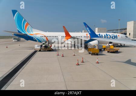 Hulhumale, Maldives - 8th May, 2022 : A Fly Dubai Boeing 737 max aircraft parked at the terminal gate at the Maldives International gate. Stock Photo