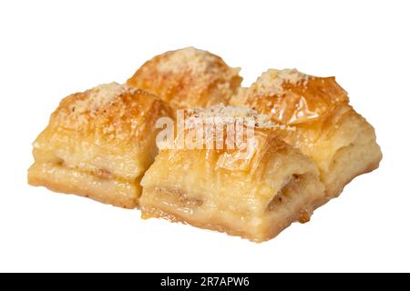 Baklava with milk and hazelnuts. Turkish cuisine delicacies. Baklava with milk isolated on white background. Local name sutlu nuriye. Close up Stock Photo