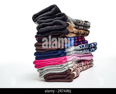 Warm wool socks folded in pile Stock Photo