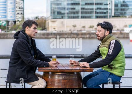Two friends hanging out after work Stock Photo