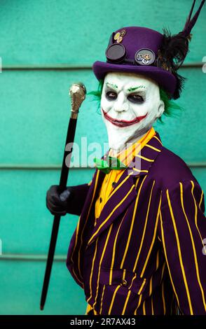 HARROGATE, UK - JUNE 3, 2023.  A male cosplayer dressed as The joker from the batman movies with mask Stock Photo