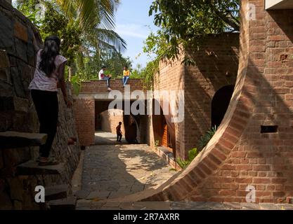 View towards rear with kids exploring. Subteranian Ruins, Kaggalipura, Bangalore, India. Architect: A Threshold Architects, 2023. Stock Photo