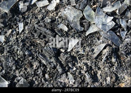 Consequences of the fire. Glass ash and coal. Stock Photo