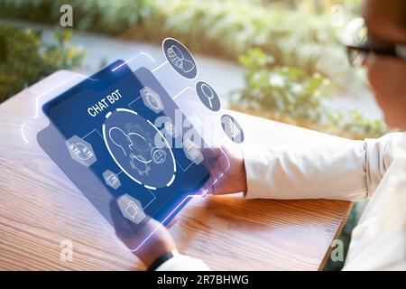 Black businesswoman holding digital tablet, using chat bot, collage Stock Photo