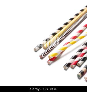 Different paper drinking straws on white background Stock Photo