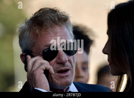 STOCKHOLM, SWEDEN - JUNE 14, 2023: Sean Penn and Olga Korotkova standing outside the Grand Hotel Stockholm Stock Photo