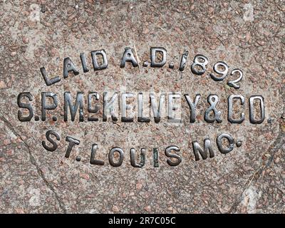 Brass sidewalk stamp in St. Louis Stock Photo