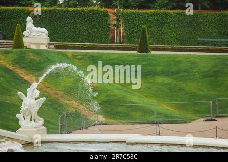 VIENNA, AUSTRIA - 11, 05, 2019: Cloudy summer day. Belvedere gardens, an imperial baroque park with ponds, fountains, nymphs, the lower belvedere pala Stock Photo