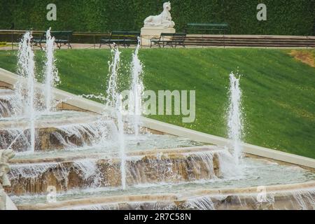 VIENNA, AUSTRIA - 11, 05, 2019: Cascading fountain in the park of the Belvedere palace complex on the background of the palace Stock Photo