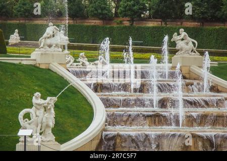 VIENNA, AUSTRIA - 11, 05, 2019: Belvedere Gardens, Imperial Baroque Park with ponds, nymphs, Lower Belvedere Palace in the background. Fountains with Stock Photo