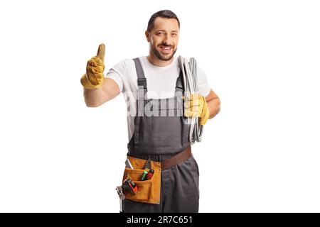 Electrician holding cable on his shoulder and gesturing thumbs up isolated on white background Stock Photo