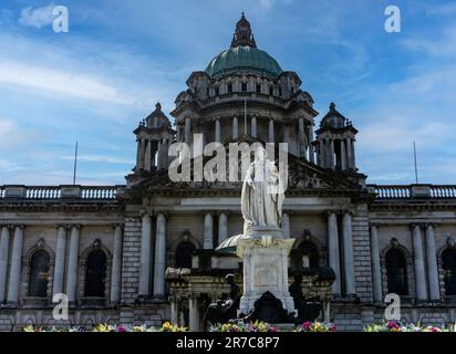The statue of Queen Victoria, outside Belfast City Hall, in Donegall Square Northern Ireland. Sculptor sir Thomas Brock.Marble statue unveiled in 1903 Stock Photo