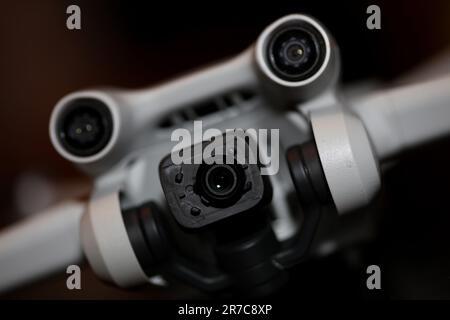 Drone with camera isolated on table close up colorful background modern aerial high quality big size instant prints Stock Photo