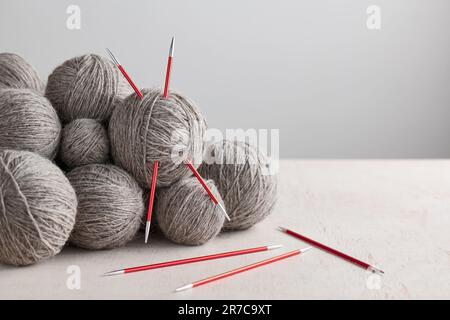 Double pointed knitting needles and balls of yarn Stock Photo