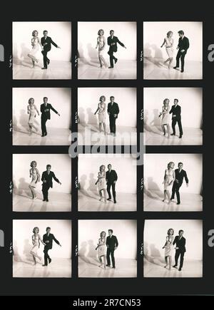 United States:  c. 1961 A proof sheet photograph of a couple demonstrating how to dance the twist. Stock Photo