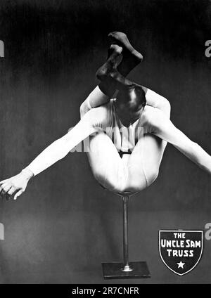Buffalo, New York:  c. 1920. A contortionist puts his legs behind his back in an ad for the Uncle Sam Truss Company. Stock Photo