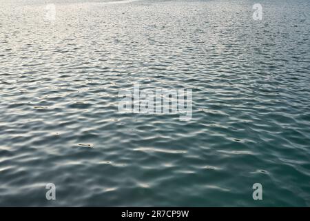Water surface seen in Abu Dhabi at dusk. Stock Photo