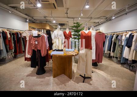 BANGKOK, THAILAND - CIRCA JANUARY, 2020: clothes displayed at the store in Siam Center shopping centre Stock Photo