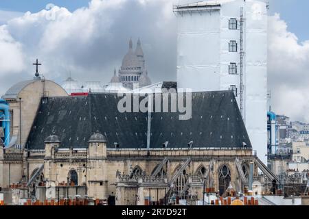 6 May 2023. Paris, France. Rooftop view of Paris preparing for the 2024 Olympics by remodeling, new construction. Telephoto shot with Sacre Coeur in Stock Photo