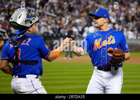 The New York Yankees and the New York Mets shake hands before lining up  together along the baselines for the 20th anniversary of the 9/11 terrorist  attacks before a baseball game on