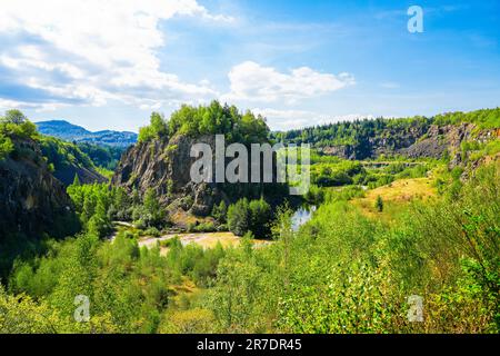 Renatured diabase quarry near Wolfshagen in the Harz Mountains. Hiking Trail of the Stones in the Harz National Park. View of the quarry and the surro Stock Photo