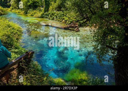 The Blue Eye Albanian: Syri i Kalter, is a water spring near Muzine in Vlore County, southern Albania. A popular tourist attraction. The water bubbles Stock Photo