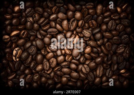 Brown coffee background.Dark with black vignette coffee background. Close-up of roasted coffee beans Stock Photo