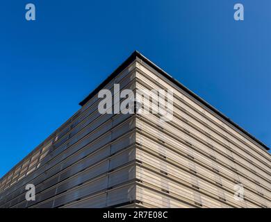 CCTV camera mounted on the exterior corner of a contemporary multstorey car park in the UK. Stock Photo