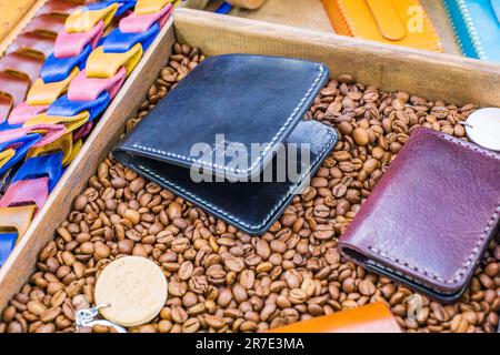 Soft tone leather wallet with coffee on a wooden table Stock Photo